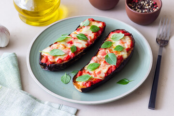 Baked eggplant with cheese mozzarella, tomatoes and basil. Healthy eating. Italian food. Parmigiana di melanzane.