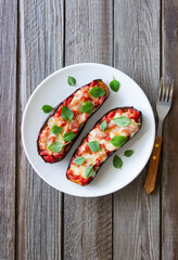 Baked eggplant with cheese mozzarella, tomatoes and basil. Healthy eating. Italian food. Parmigiana di melanzane.