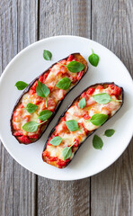Baked eggplant with cheese mozzarella, tomatoes and basil. Healthy eating. Italian food. Parmigiana di melanzane.