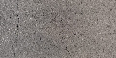 panorama view from above on surface texture of old asphalt road with cracks
