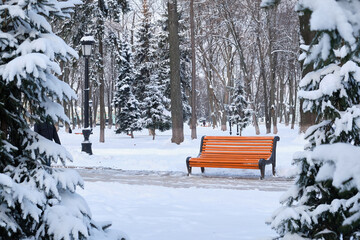 Benches in the winter city park. Filled up with snow.