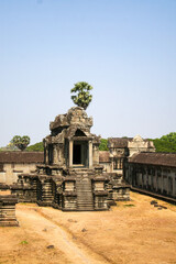 A building with steps in Angkor Wat, a temple complex in Cambodia, the largest religious monument in the world, and a UNESCO World Heritage Site.  Image has copy space.