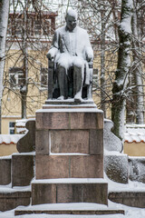 Jozef Montwill bronze statue covered by the snow in Vilnius old town, Polish-Lithuanian social worker, bank owner and philanthropist, vertical - obrazy, fototapety, plakaty