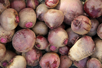 Ripe fresh red beetroot on a wooden background