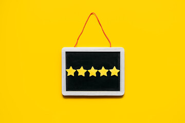 Customer Experience, Review Concept. Five yellow stars excellent rating in frame on yellow background. Customers Ratings and Reviews