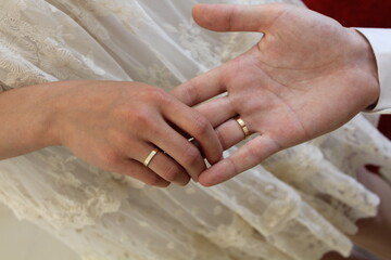 Married couple hands with wedding rings
