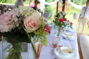 wedding table with a bouquet in the boho style