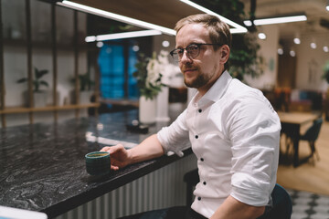 Businessman drinking coffee during break