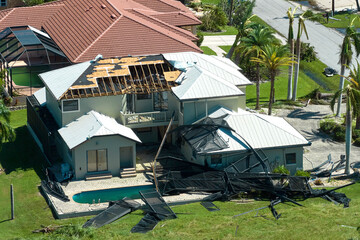 Hurricane Ian destroyed house in Florida residential area. Natural disaster and its consequences