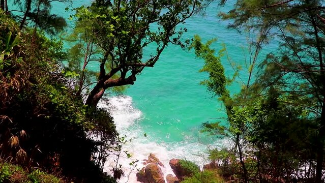 Nai Thon Naithon Beach view behind trees Phuket Thailand.
