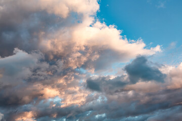 Sunset sky with dark clouds and orange light