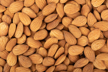 Full frame of grains of almond nuts, almond background.
