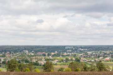 Fototapeta premium View of the village from the hill. Moldovan village and autumn cloudy rainy sky
