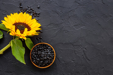 Yellow sunflowers with black seeds. Top view. Harvest season background
