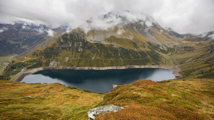 Alpine lake with clean clear water in the bowl of the Alpine mountains. Austria, Salzburg, Gastein Valley