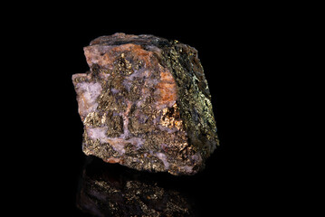 A fragment of the mineral chalcoperite with a golden coating on the surface and white veins