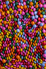 Candy coated chocolate button sprinkle texture