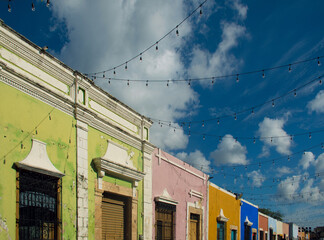 The center of the old Mexican colonial city of Campeche, a colorful street decorated with garlands.