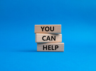 You can help symbol. Wooden blocks with words You can help. Beautiful blue background. Business and...