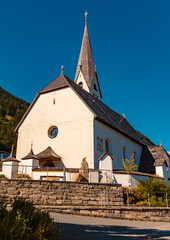 Fototapeta na wymiar Beautiful alpine summer morning view with a church near Saint Jakob in Haus, Pillersee lake valley, Kitzbuehel, Tyrol, Austria