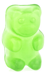 Sweet jelly candy - green gummy bear isolated on a white background.