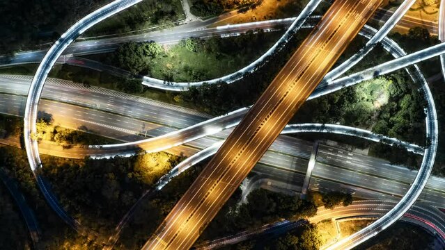 time lapse aerial view of road intersection at night