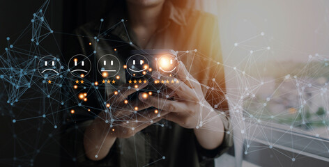 Businessman pressing icon emoticon face smiley on virtual touch screen. Customer service evaluation concept. survey, feedback, review.