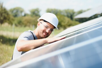 A man working at solar power station.