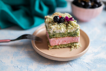 delicious sweet cake biscuit with pistachio cream with layers in a restaurant