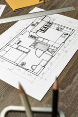 Design sketch of the interior on paper at the desktop. Blueprints.