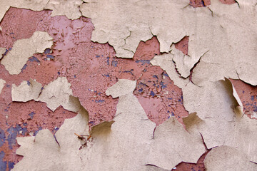 Background showing peeling dark red terracotta tile paint