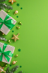 Christmas mood concept. Top view vertical photo of gift boxes with ribbon bows gold and green baubles star ornaments confetti and pine branches in frost on isolated green background