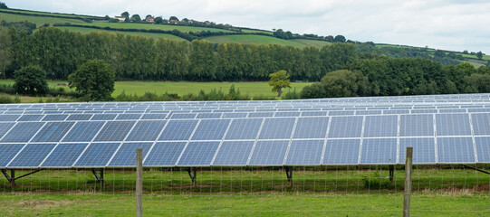 Arrays of solar panels installed on a farm in East Devon in UK