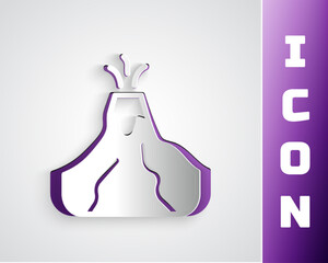 Paper cut Volcano eruption with lava icon isolated on grey background. Paper art style. Vector