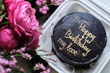Bento cake with wishes for a Happy Birthday. Sweet gift for the holiday. Korean style cakes in a box for one person
