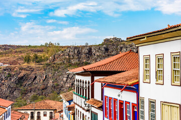 View of colonial style houses facade and mountains in the background on Diamantina city, Minas Gerais state, Brazil