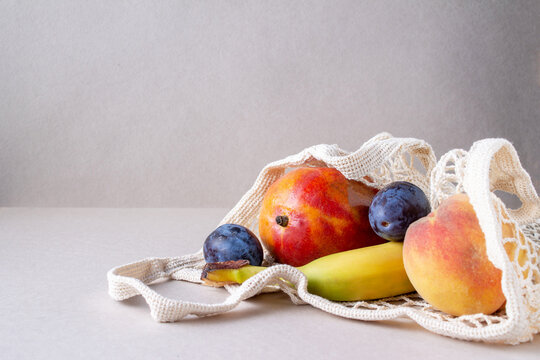 A String Bag With Fruit Lies On The Table, Copy Space