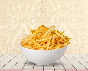 Tasty fast food French fries in plate