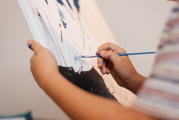 Painting for beginners, hand draws a picture by numbers with acrylic paints on canvas artist draws...