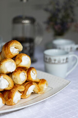 Homemade puff pastry cones stuffed with egg white cream