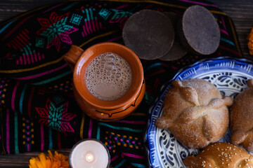 clay cup of Mexican hot chocolate on table in Mexico 