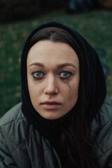 portrait of crying young woman on the street