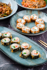 Hot tempura roll with salmon and cheese, Traditional delicious sushi roll set. Sushi menu