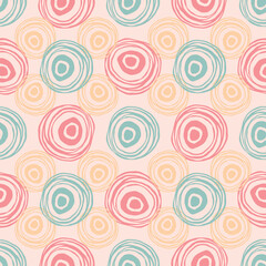 Scribble circles texture. Green, red, orange and pink colors. Regular abstract seamless pattern. Hand drawn elements background for wrapping, fabric, wallpaper or cards.