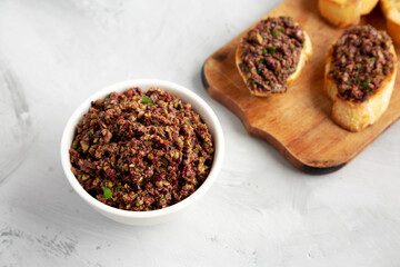 Homemade Mixed Olive Tapenade in a Bowl, side view.