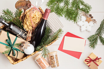 Refined Christmas gift basket for culinary enthusiats with bottle of wine and italian cusine...