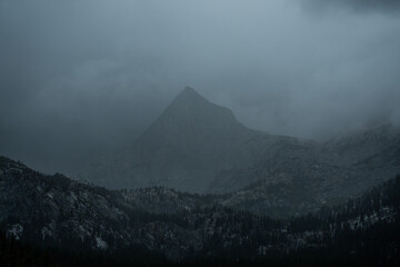 A mountain veiled in fog