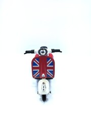Obraz premium Miniature scooter motorcycle, isolated on a white background, front view.