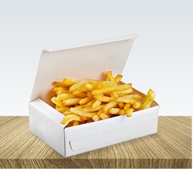 Tasty fast food French fries in box