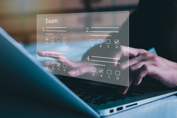 online exam concept, choose correct answer in test.  checklist and online testing on laptop. online exam test with laptop.  on-line questionnaire results on desktop. quiz.